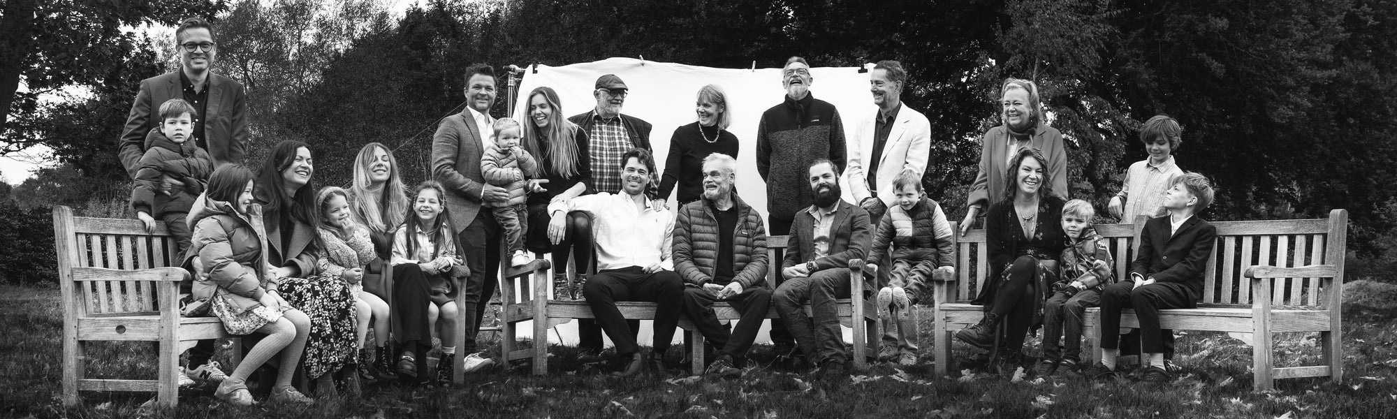 Black and white photo of the Trollbeads family gathering outdoors.