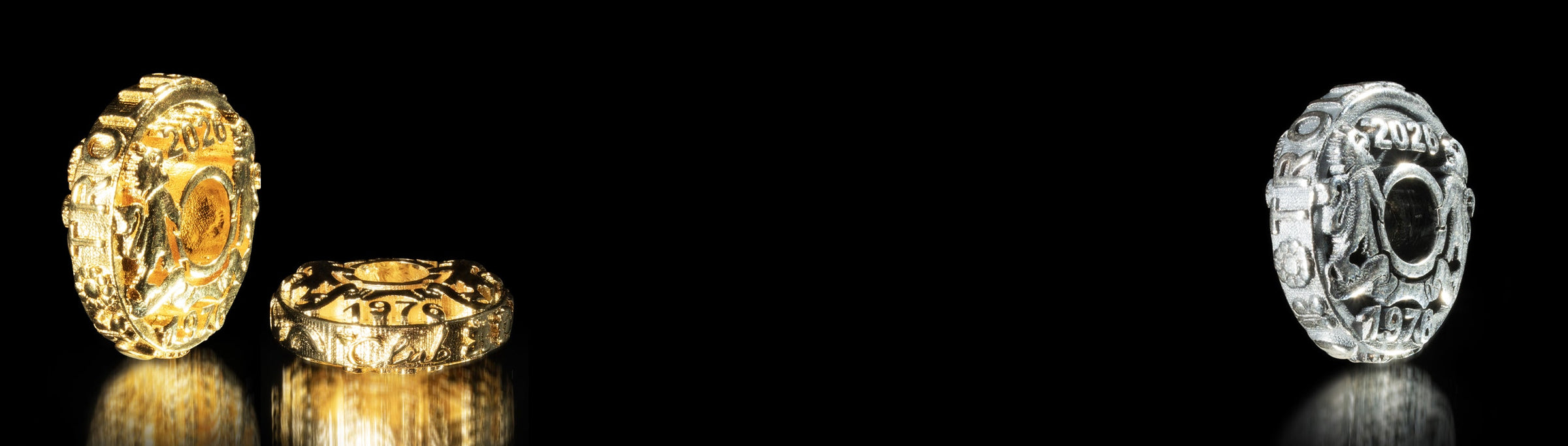 Gold plated and sterling silver jubilee coins with many details on black background